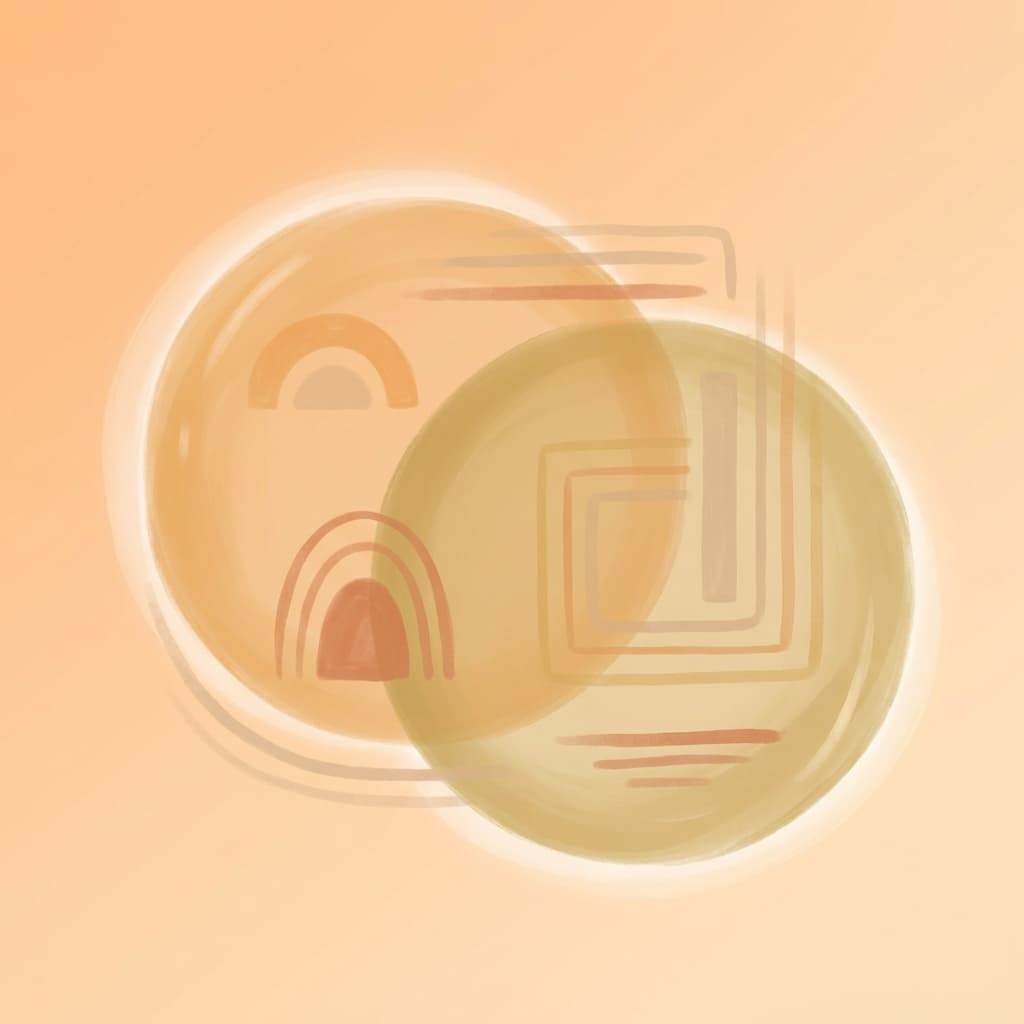 Two overlapping circles in warm amber and gold, representing co-regulation and nervous system attunement between partners